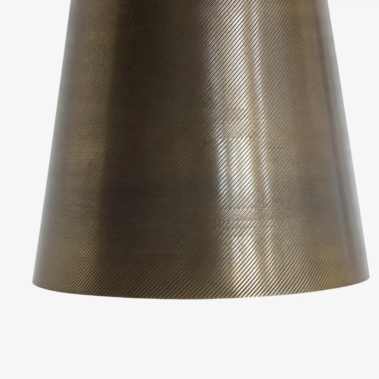 Close-up of the hand-carved brass texture