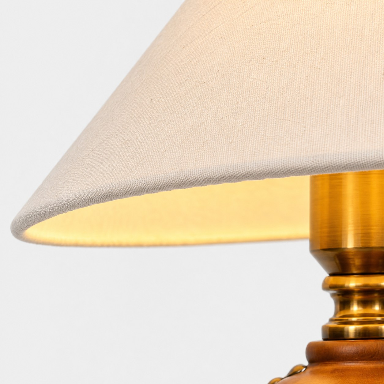 Off-white textured shade and brass-tone fitting